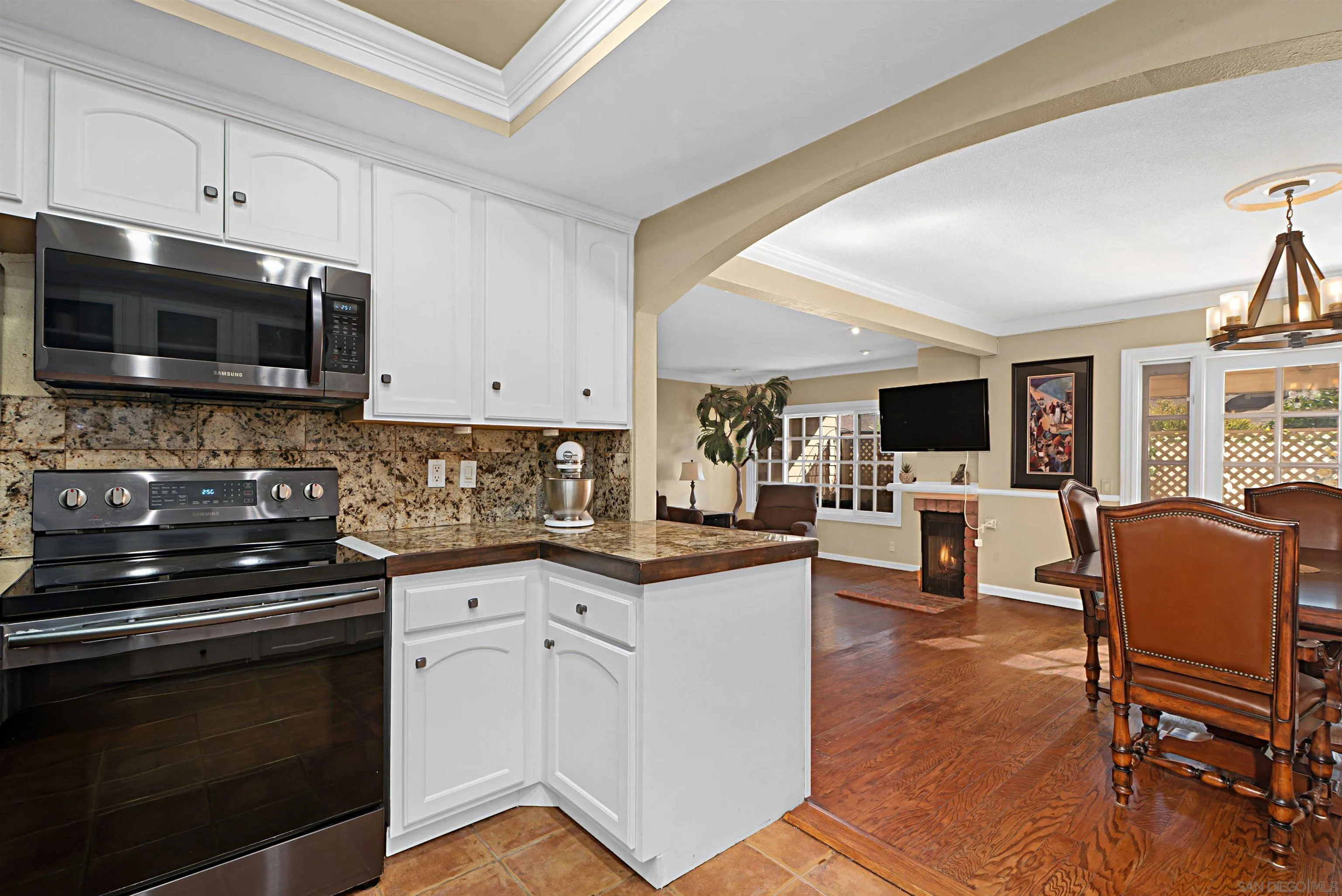 9917 Aviary Drive San Diego, CA 92131 - Photo 13 of 40 a kitchen with granite countertop appliances cabinets and furniture