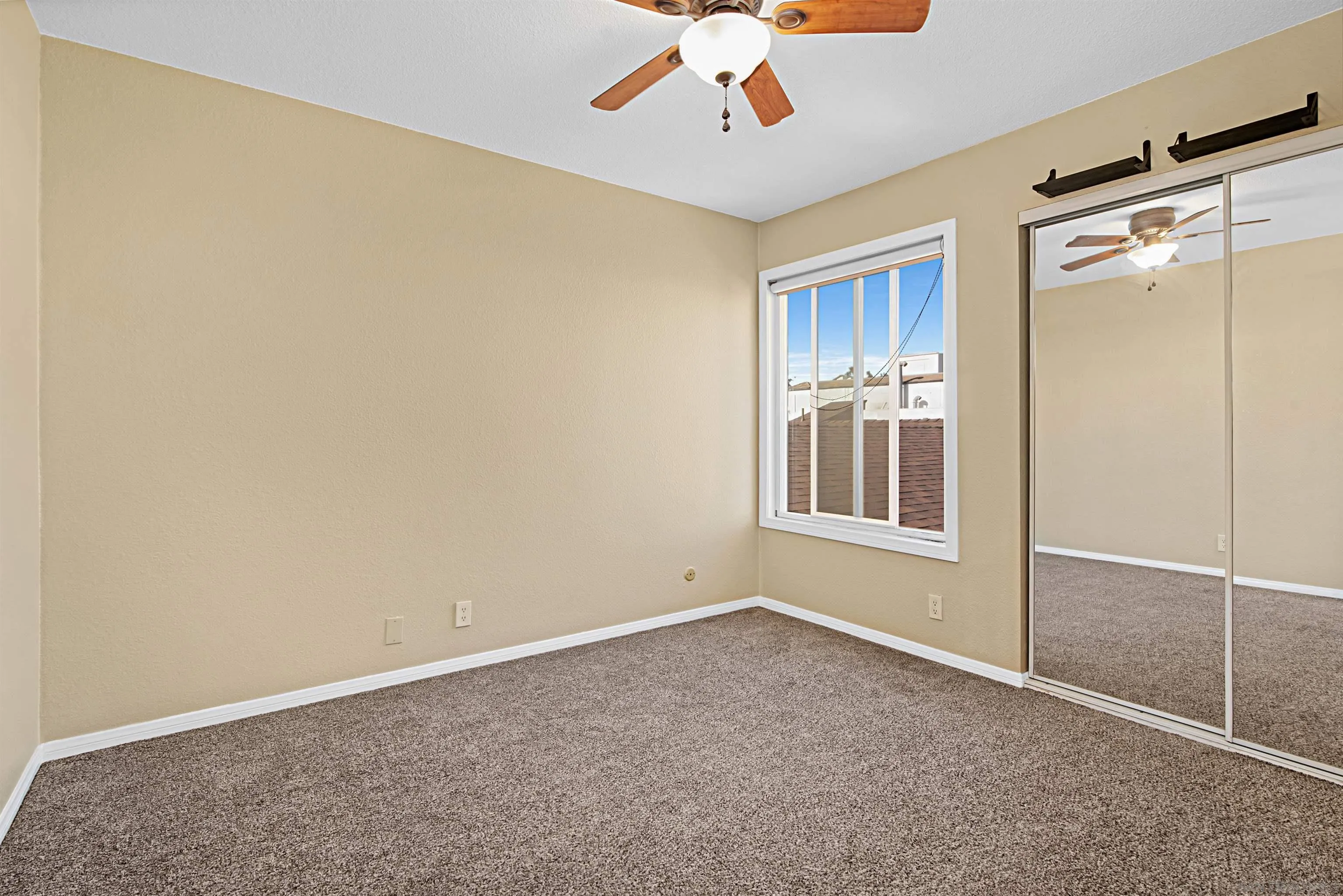 9917 Aviary Drive San Diego, CA 92131 - Photo 27 of 40 a view of an empty room with a window