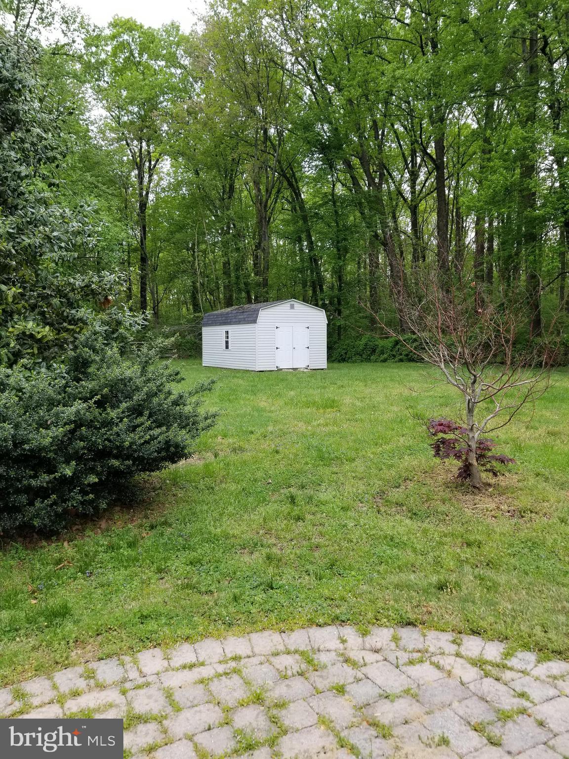 291 Charles Hall Road Millersville, MD 21108 - Photo 16 of 29 Patio, fenced yard to large Amish Shed