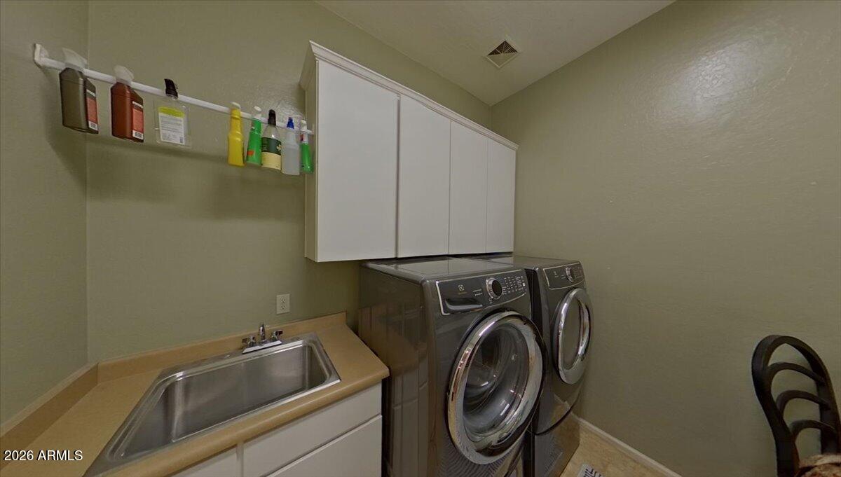 6427 South Magic Court Gilbert, AZ 85298 - Photo 42 of 71 a utility room with dryer and washer