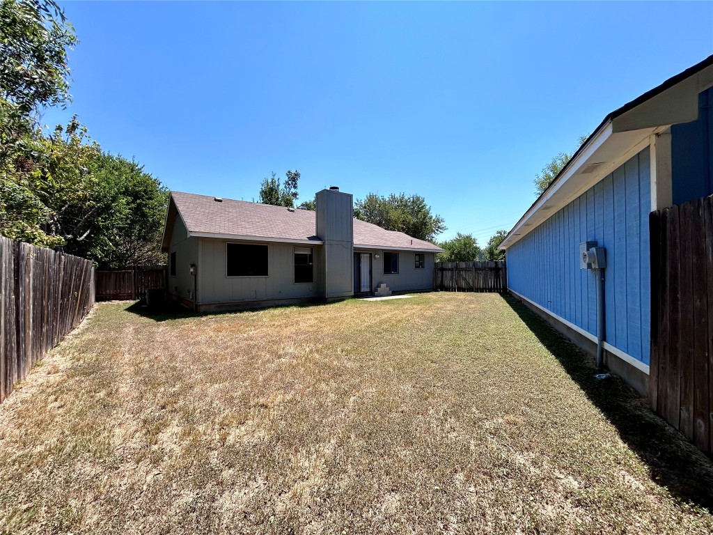 1908 Rainy Meadows Drive Austin, TX 78758 - Photo 17 of 17 a view of a house with a backyard