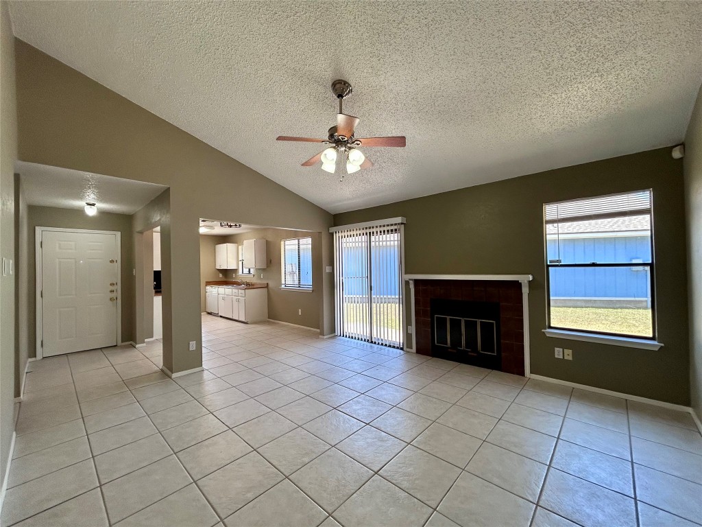 1908 Rainy Meadows Drive Austin, TX 78758 - Photo 3 of 17 a view of a livingroom with a fireplace and window