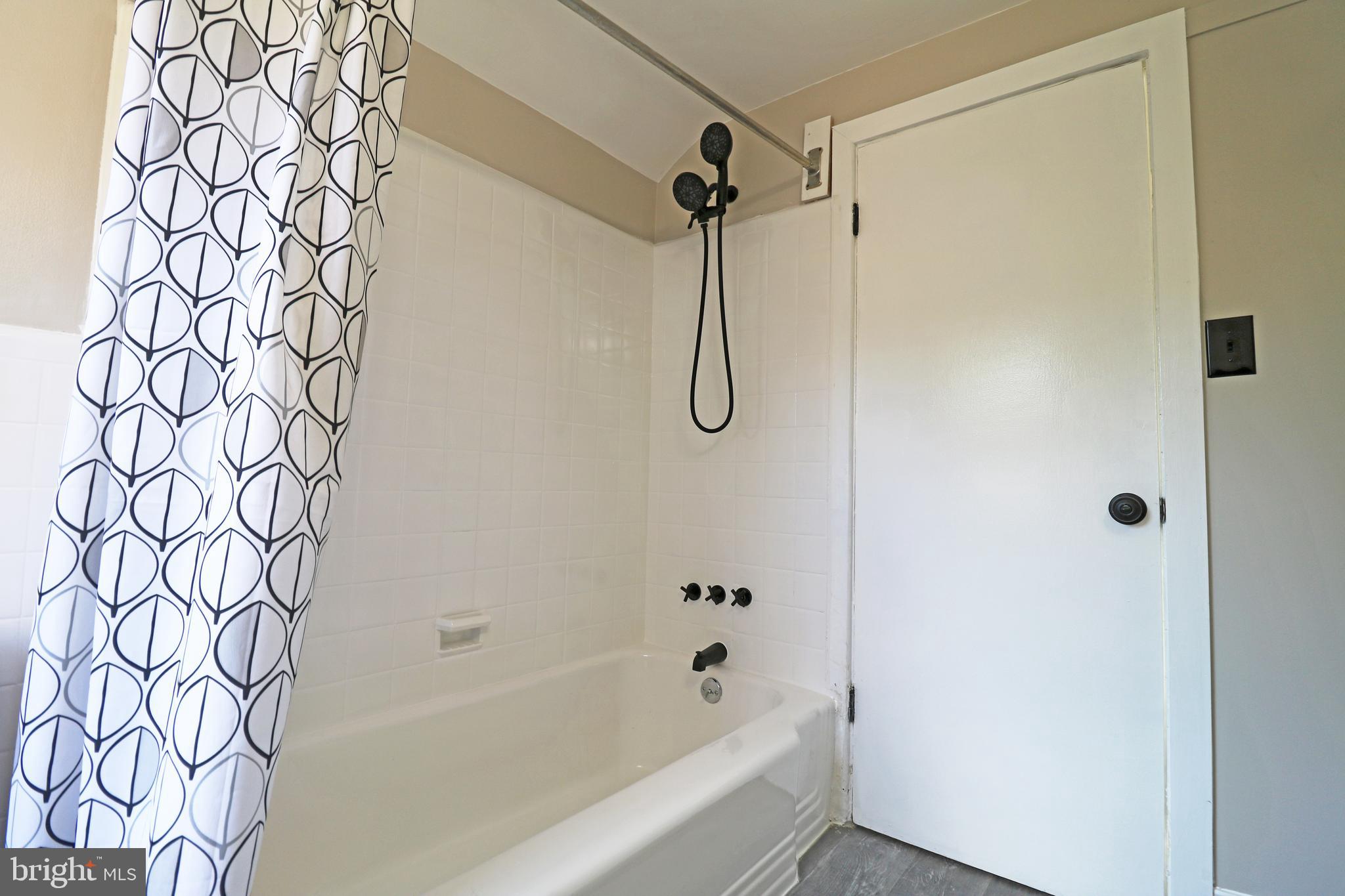 1016 Lamb Road Secane, PA 19018 - Photo 25 of 41 a bathroom with a bathtub and shower