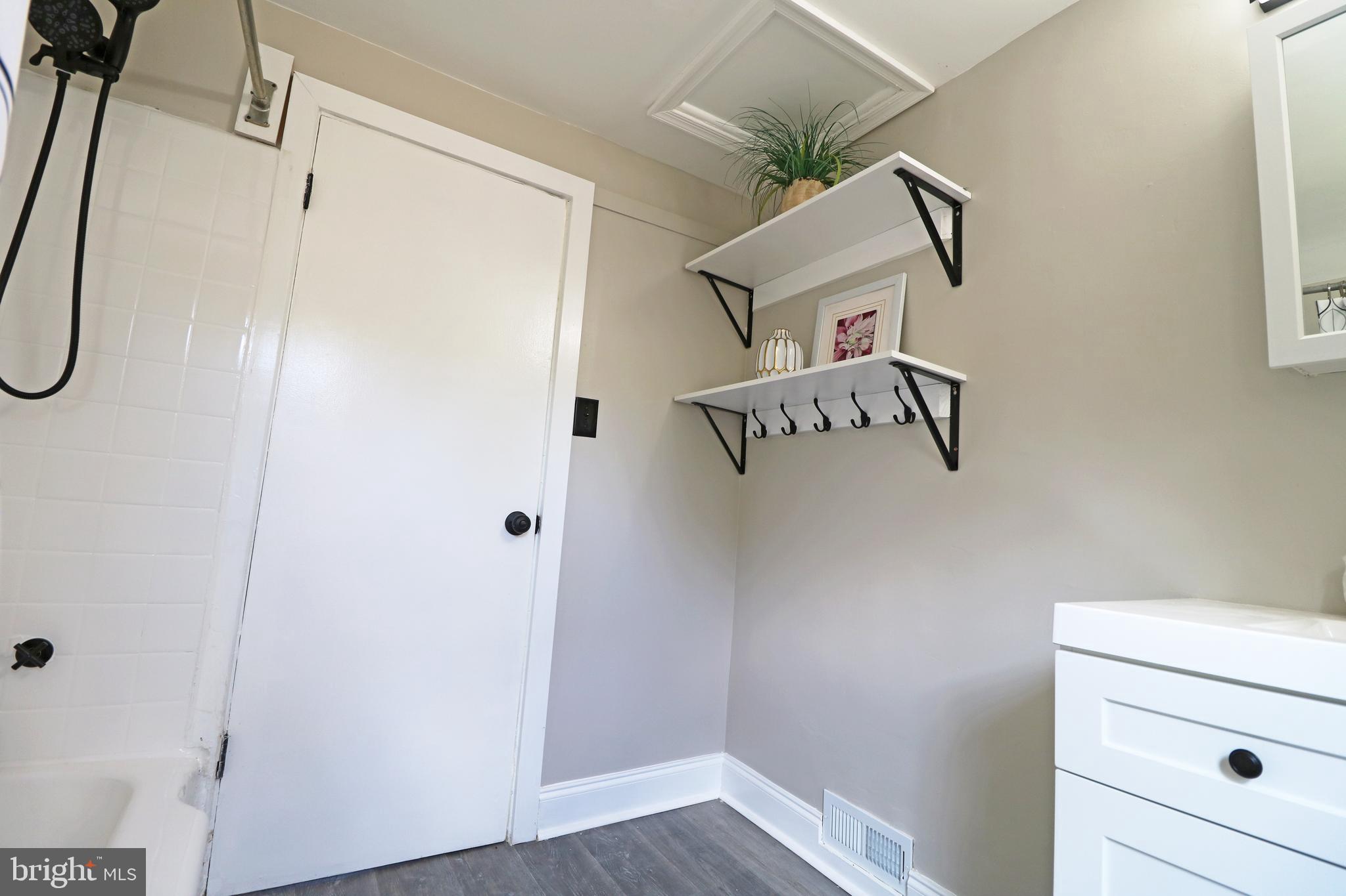 1016 Lamb Road Secane, PA 19018 - Photo 26 of 41 a bathroom with a shower and a ceiling fan
