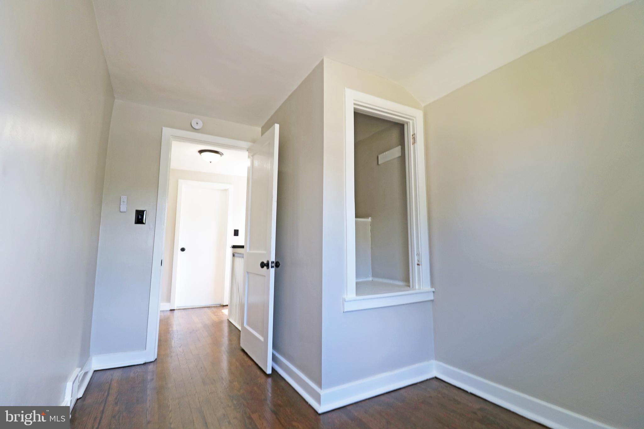 1016 Lamb Road Secane, PA 19018 - Photo 32 of 41 a view of a hallway with wooden floor