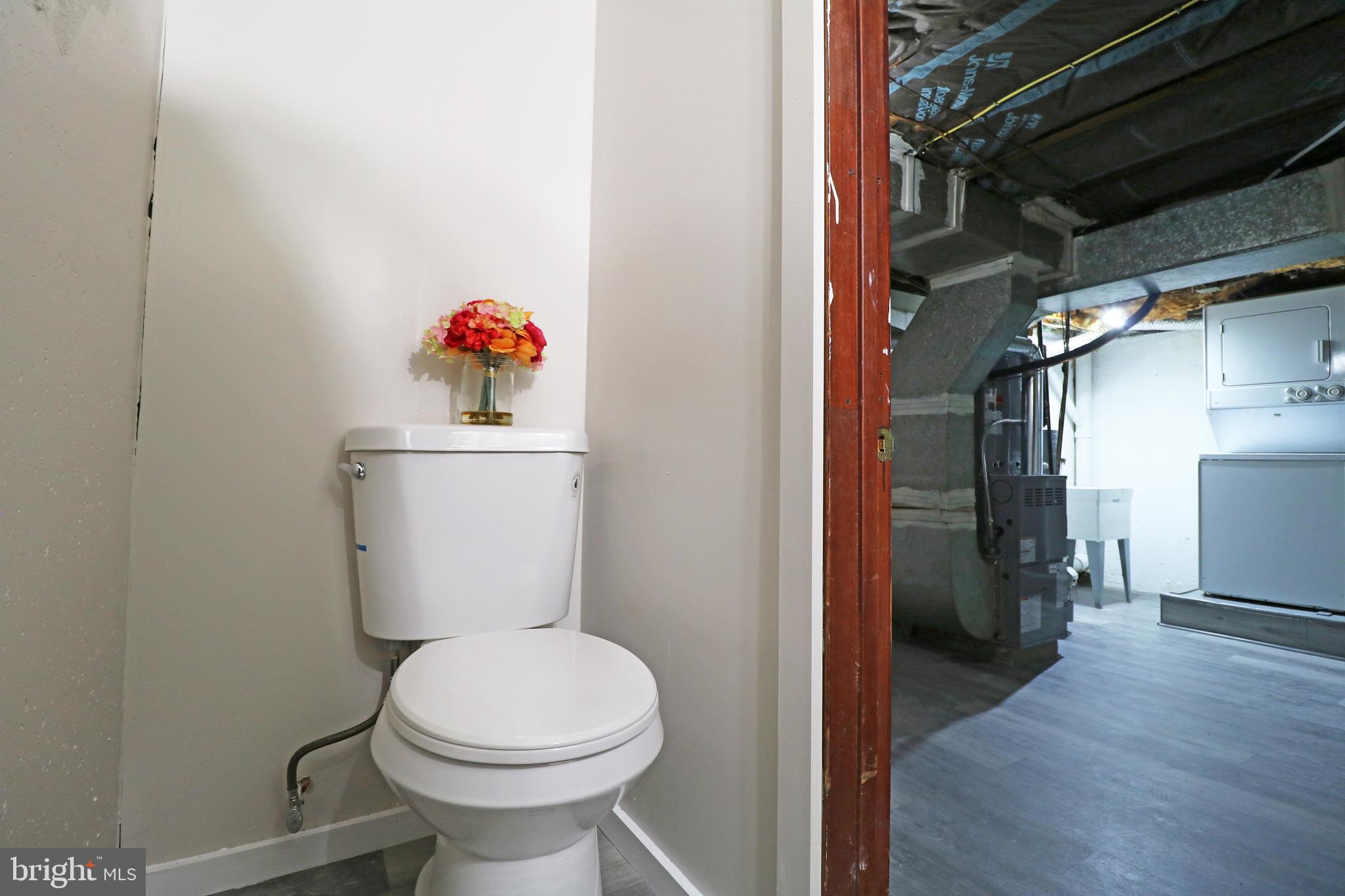 1016 Lamb Road Secane, PA 19018 - Photo 39 of 41 a bathroom with a toilet and a shower
