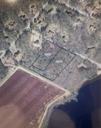 Lot 2 Bishop Road Rochester, MA 02770 - Photo 1 of 11 a view of a dry yard with wooden floor