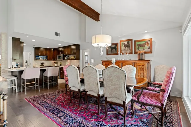 a living room with furniture a clock and a clock