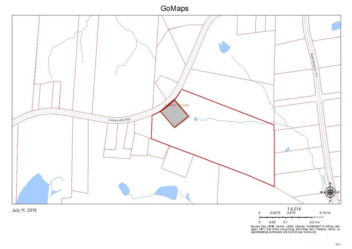 5202 Leesville Road Durham, NC 27703 - Photo 2 of 4 a picture of a glass window with a white house