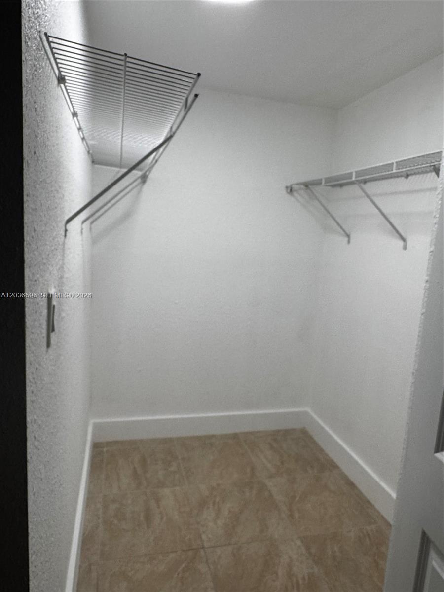 2301 Southwest 27th Avenue, Unit 503 Miami, FL 33145 - Photo 15 of 24 a view of a room with racks on the wall
