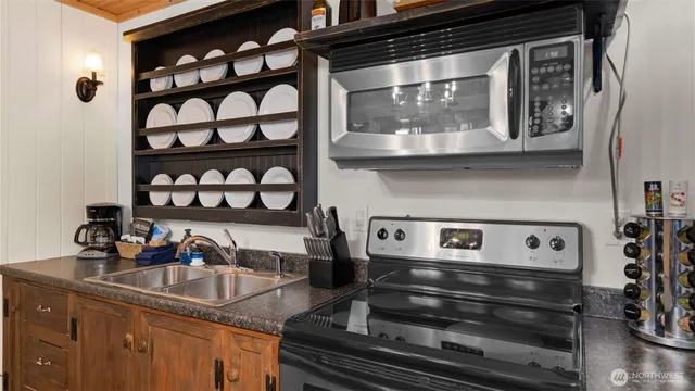 a kitchen with a sink and cabinets