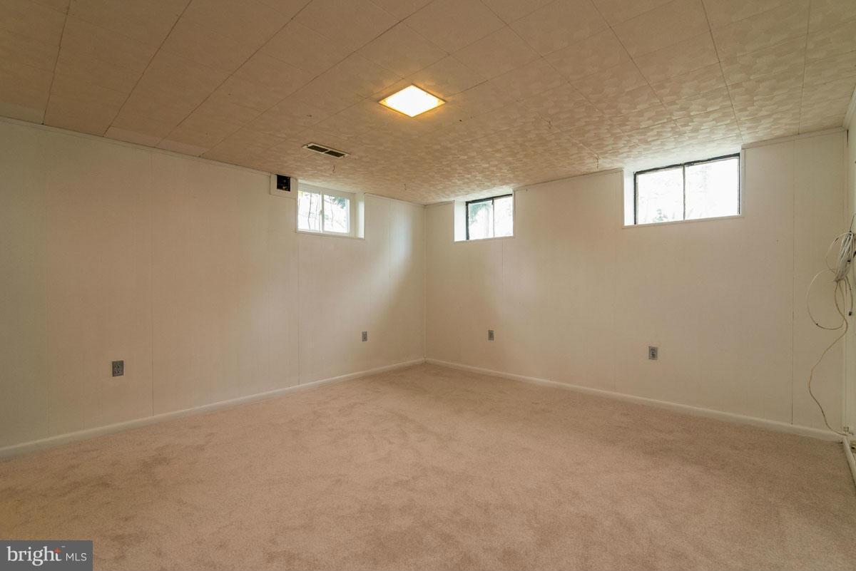 1561 Clairidge Road Baltimore, MD 21207 - Photo 22 of 28 a view of an empty room with a window