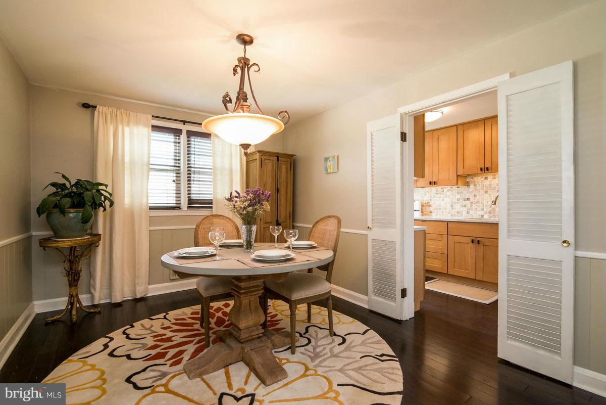 1561 Clairidge Road Baltimore, MD 21207 - Photo 8 of 28 a view of a dining room with furniture window and wooden floor
