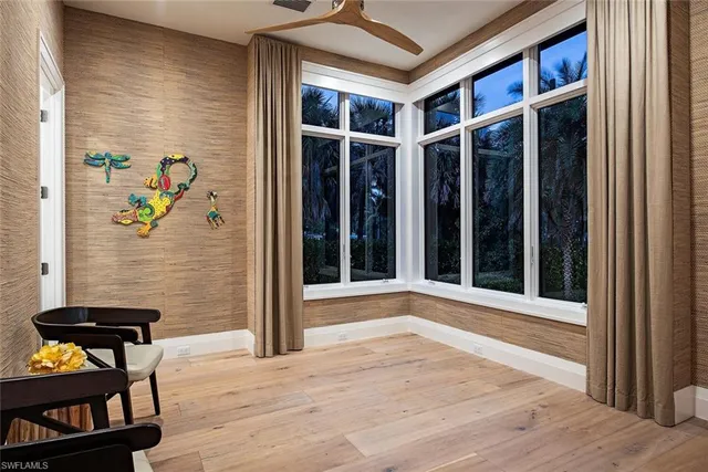 a view of wooden door and a bench in patio