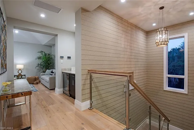 a view of a livingroom with furniture and a kitchen