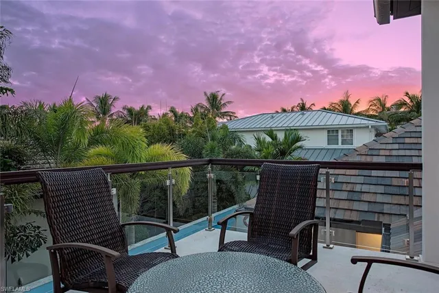 a bedroom with a large bed and a tv on table