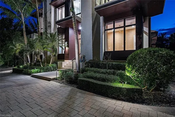 a view of a house and a yard and plants