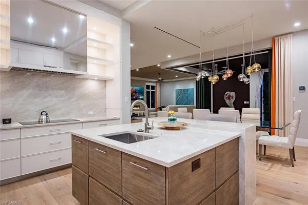 a kitchen with a sink and cabinets
