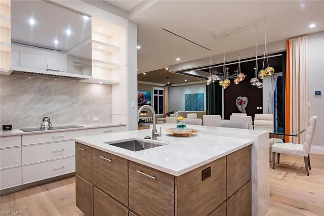a kitchen with a sink and cabinets