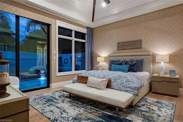 a bedroom with a large bed and a couch