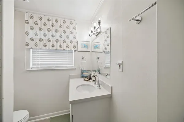 a bedroom with furniture and a wooden floor