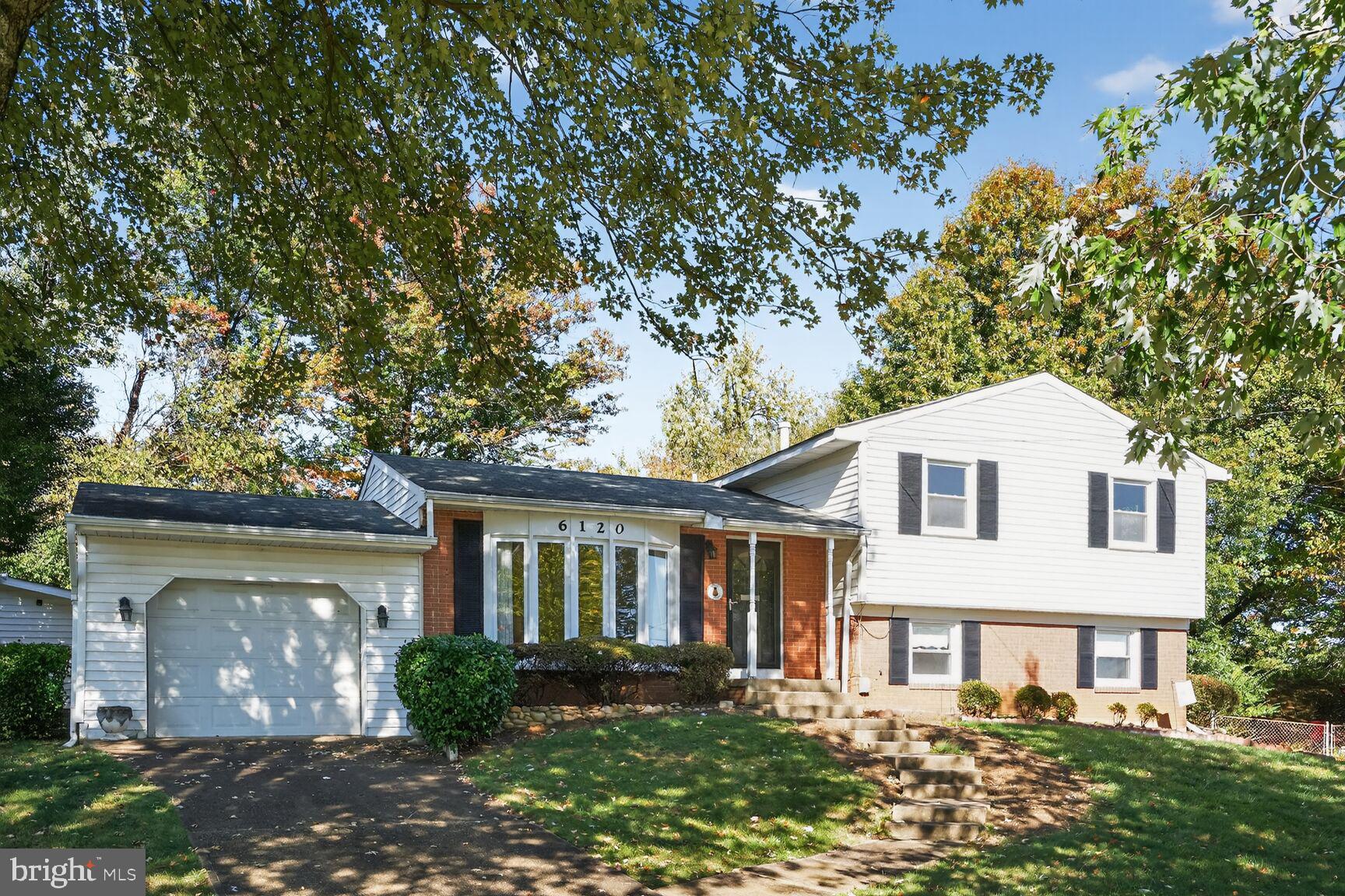 6120 Squire Lane Alexandria, VA 22310 - Photo 1 of 26 front view of a house with a yard