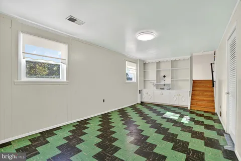 a view of a room with window and furniture