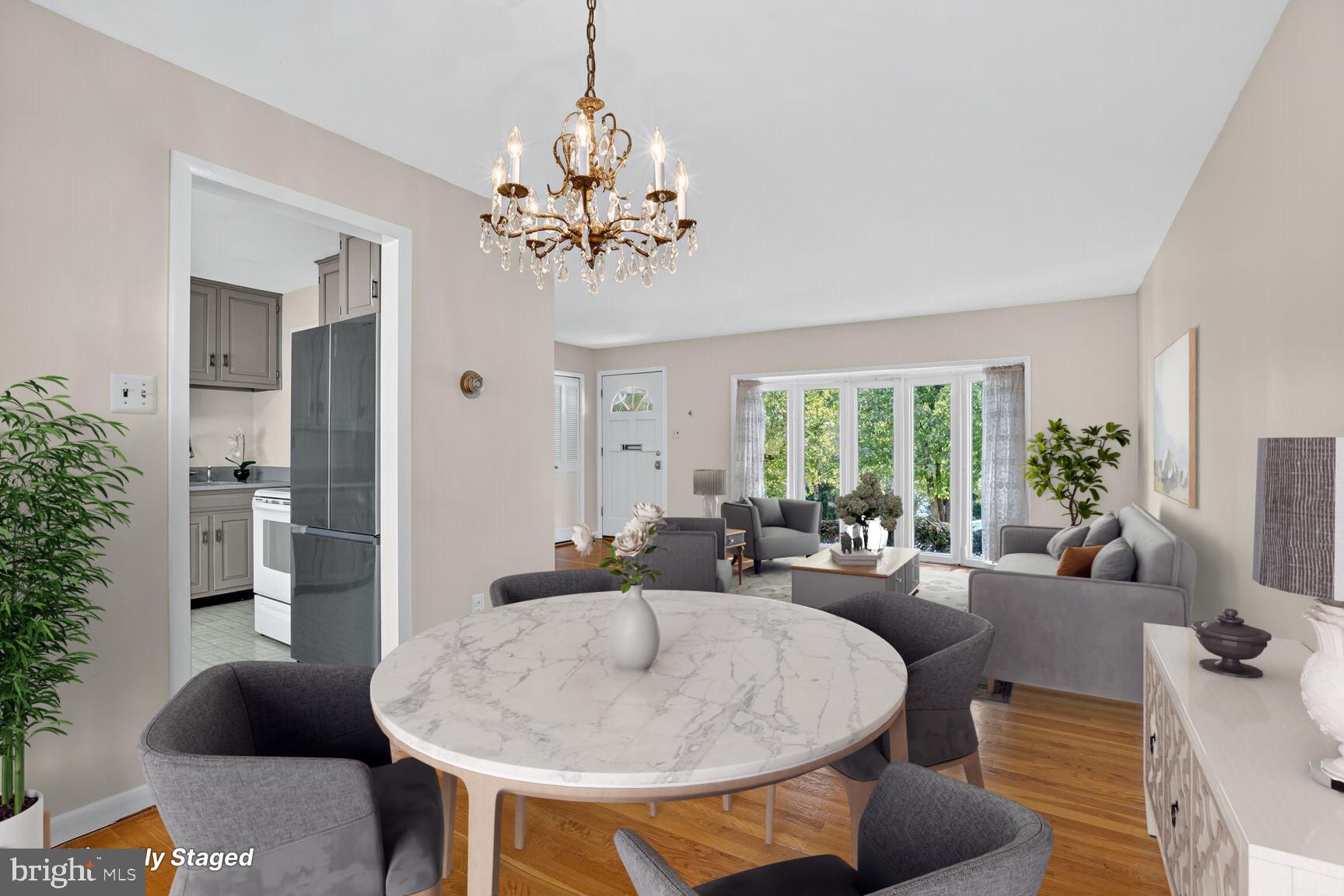 6120 Squire Lane Alexandria, VA 22310 - Photo 2 of 26 a living room with furniture a chandelier and a dining room