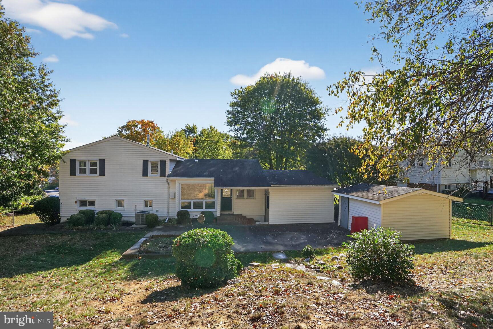 6120 Squire Lane Alexandria, VA 22310 - Photo 24 of 26 a backyard of a house with a garden and plants