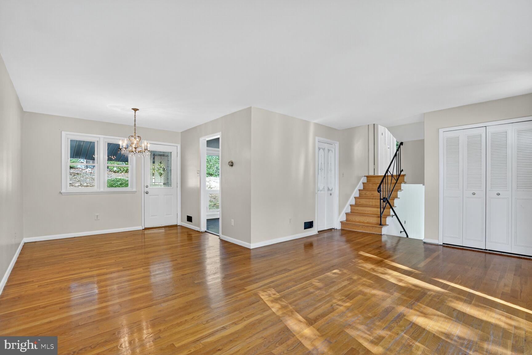 6120 Squire Lane Alexandria, VA 22310 - Photo 5 of 26 a view of an empty room with wooden floor and a window