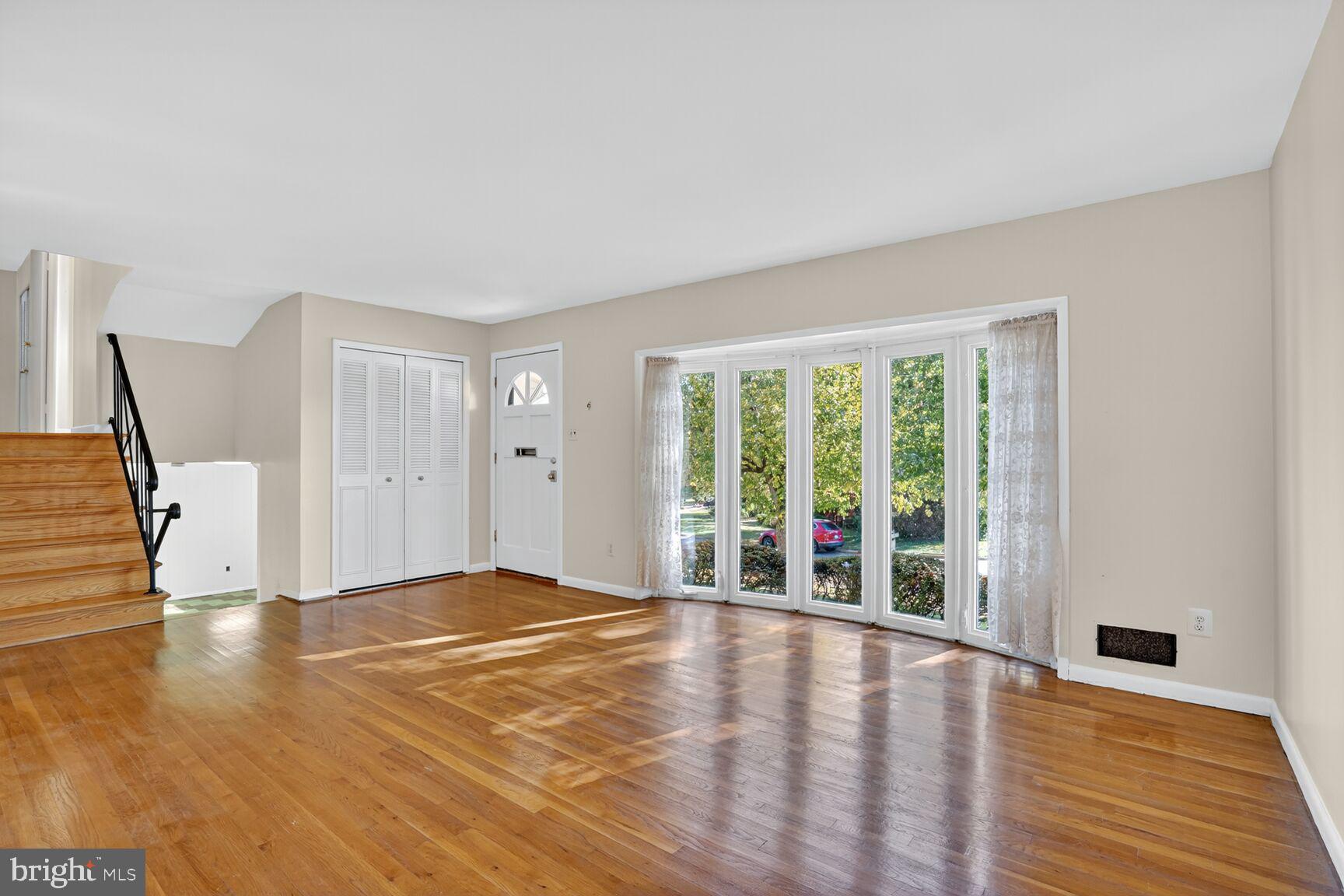 6120 Squire Lane Alexandria, VA 22310 - Photo 7 of 26 a view of empty room with wooden floor and fan