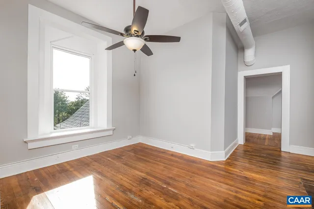 a kitchen with granite countertop a refrigerator and a stove