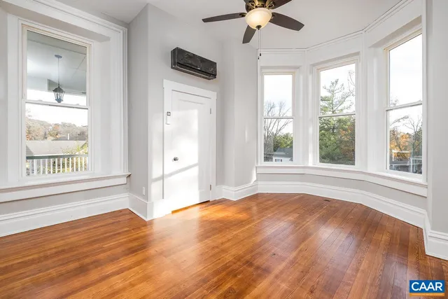 a kitchen with stainless steel appliances white cabinets and a refrigerator