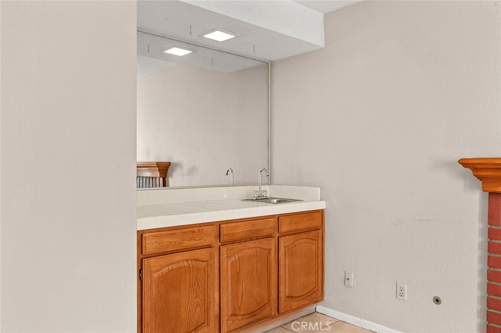 31348 Huron Street Temecula, CA 92592 - Photo 16 of 46 a bathroom with a sink and a mirror