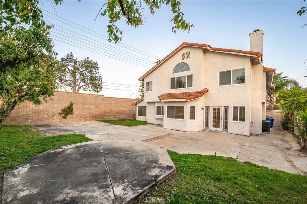 31348 Huron Street Temecula, CA 92592 - Photo 34 of 46 a front view of a house with a garden and yard