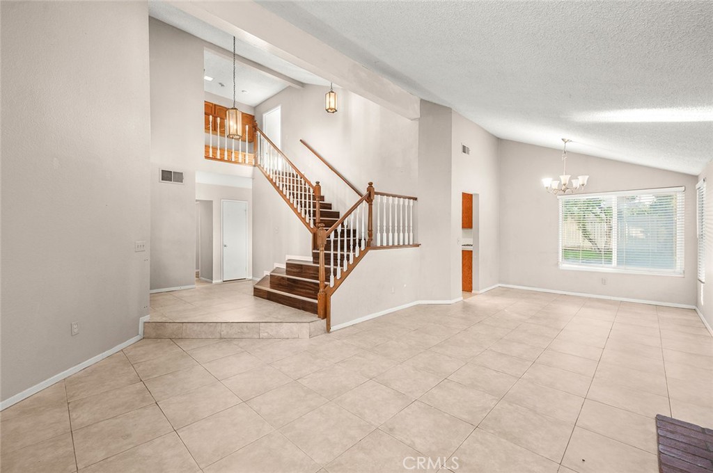 31348 Huron Street Temecula, CA 92592 - Photo 7 of 46 a view of entryway with wooden floor and stairs
