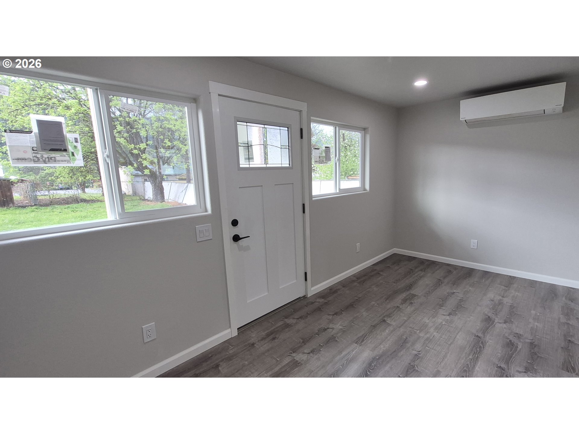 119 Walnut Street Myrtle Creek, OR 97457 - Photo 5 of 10 a open hall with a fireplace and window