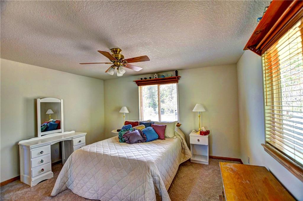 293 Old Squaw Road Como, CO 80432 - Photo 17 of 21 a bedroom with a bed and a window