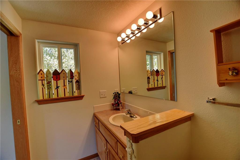 293 Old Squaw Road Como, CO 80432 - Photo 8 of 21 a bathroom with a sink and a mirror