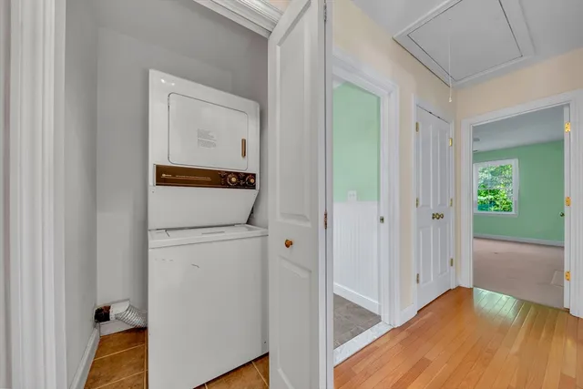 a view of hallway with wooden floor