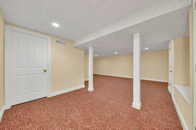 a view of an empty room and wooden floor