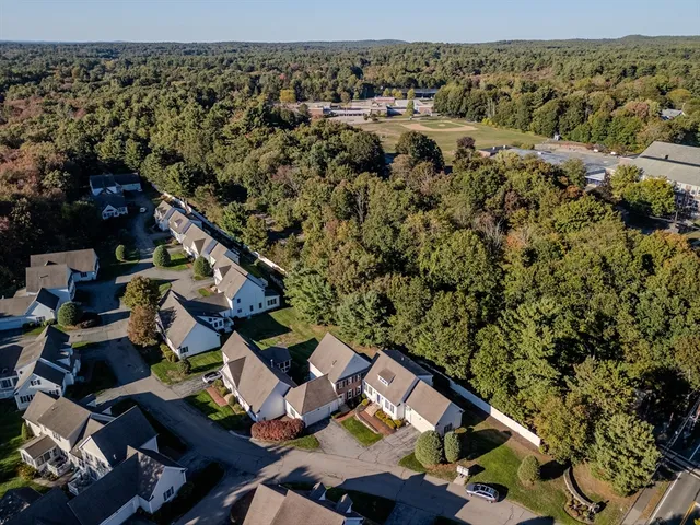 an aerial view of house with yard