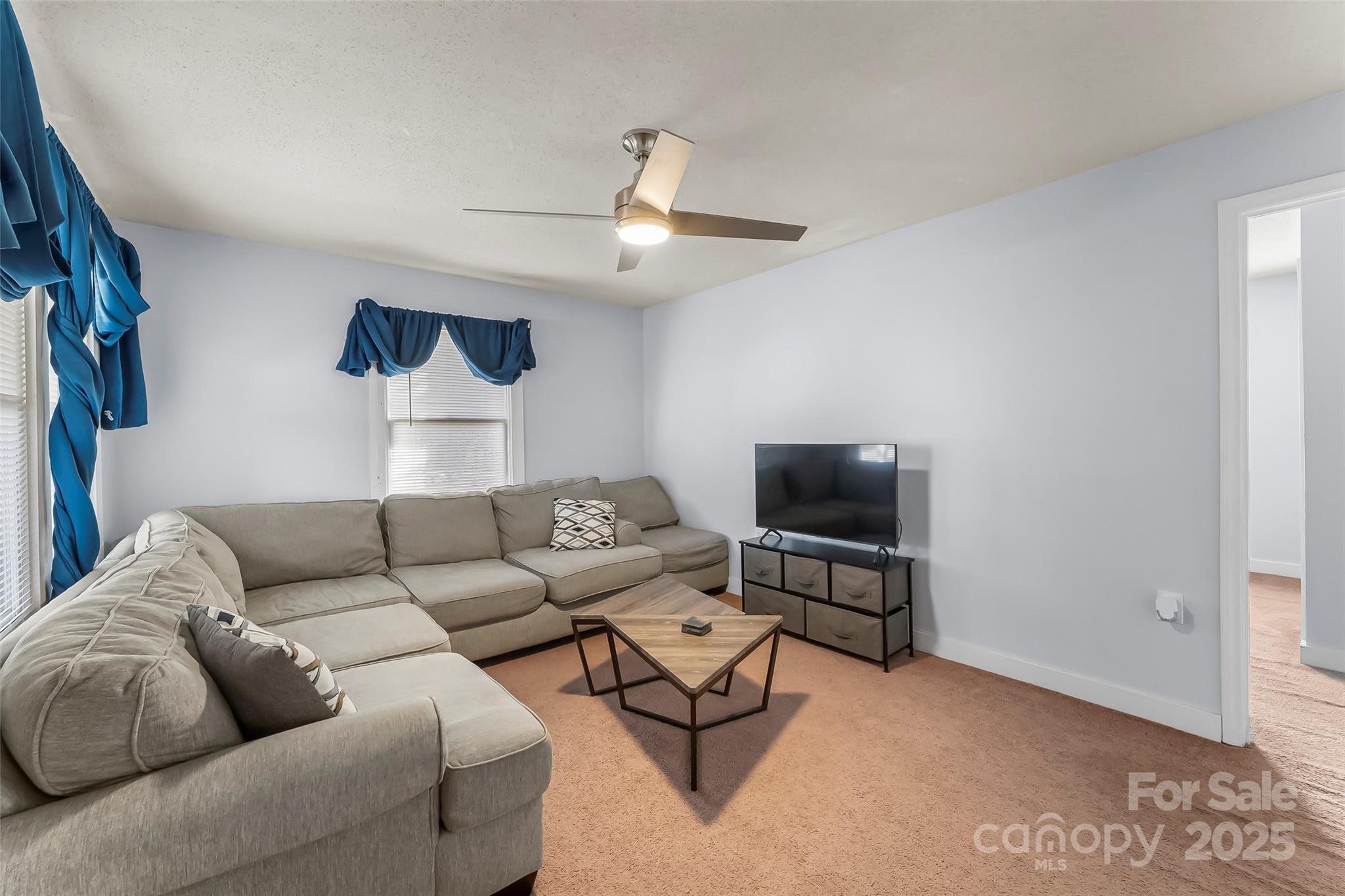 601 West 2nd Street Cherryville, NC 28021 - Photo 3 of 19 a living room with furniture and a flat screen tv