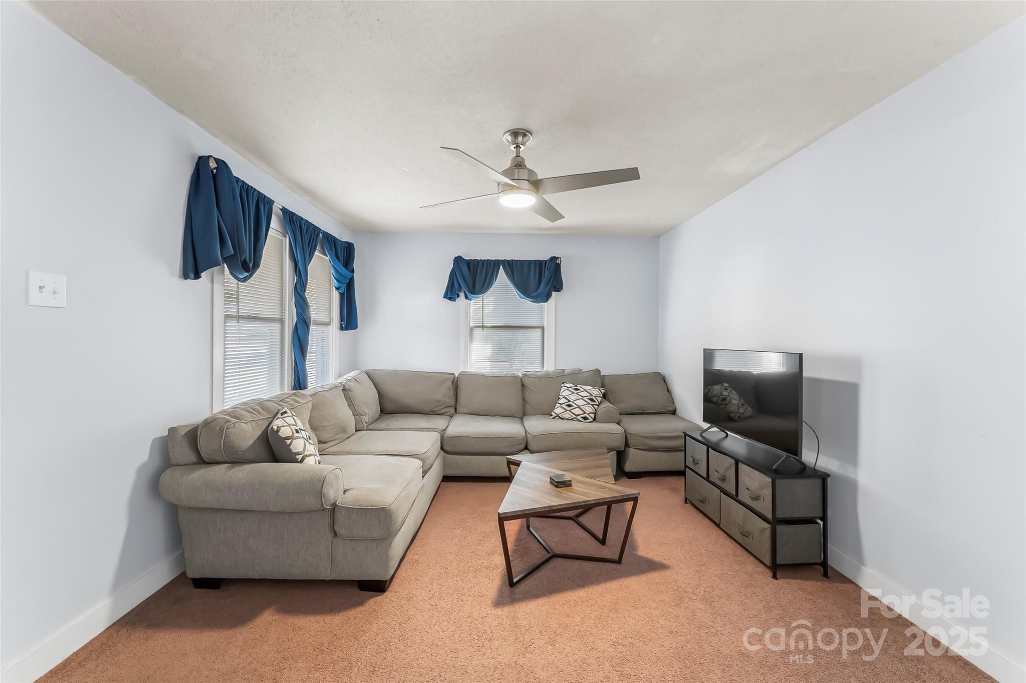 601 West 2nd Street Cherryville, NC 28021 - Photo 4 of 19 a living room with furniture and a flat screen tv