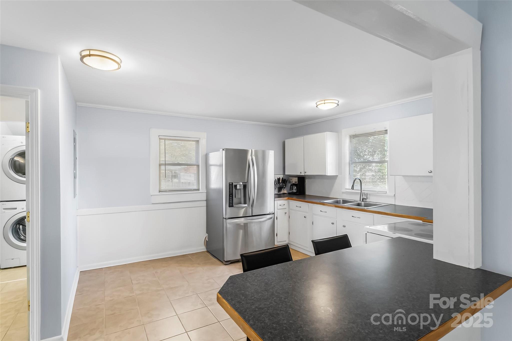 601 West 2nd Street Cherryville, NC 28021 - Photo 6 of 19 a kitchen with stainless steel appliances granite countertop a sink stove and refrigerator