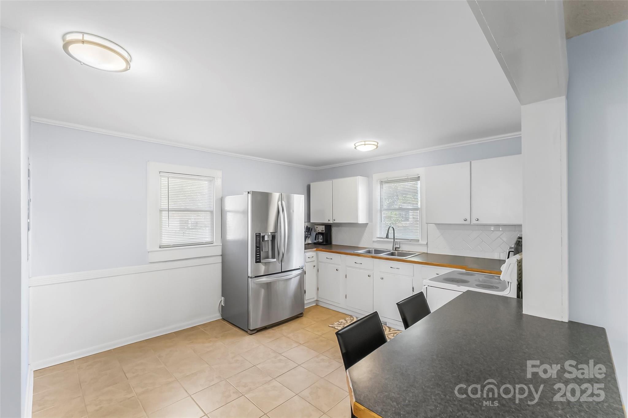 601 West 2nd Street Cherryville, NC 28021 - Photo 7 of 19 a kitchen with stainless steel appliances granite countertop a refrigerator sink and cabinets