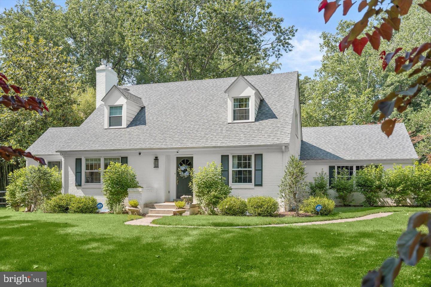 8436 Burning Tree Road Bethesda, MD 20817 - Photo 1 of 33 a front view of a house with a yard