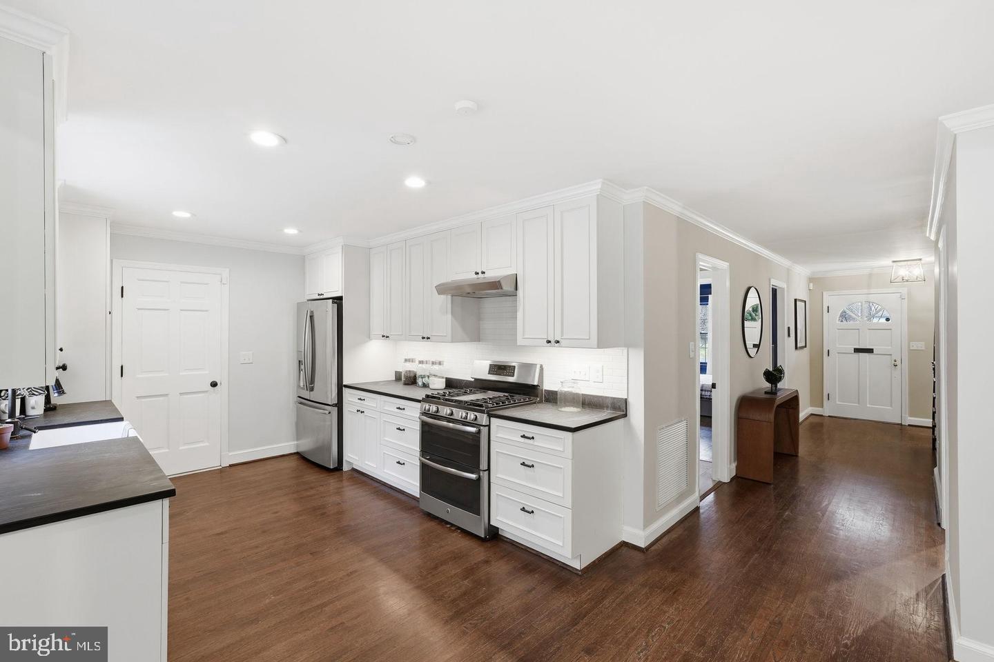 8436 Burning Tree Road Bethesda, MD 20817 - Photo 6 of 33 a kitchen with stainless steel appliances granite countertop a stove and a refrigerator