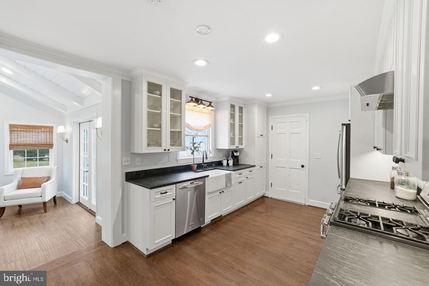8436 Burning Tree Road Bethesda, MD 20817 - Photo 7 of 33 a kitchen with stainless steel appliances granite countertop a stove and a sink