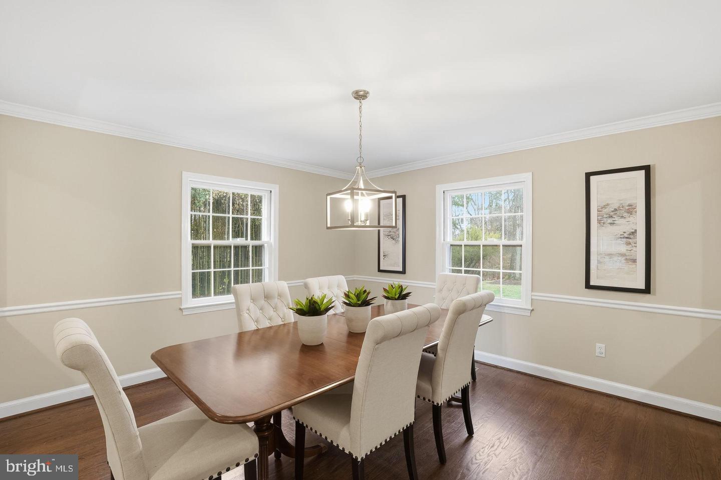 8436 Burning Tree Road Bethesda, MD 20817 - Photo 10 of 33 a dining room with furniture a window and wooden floor
